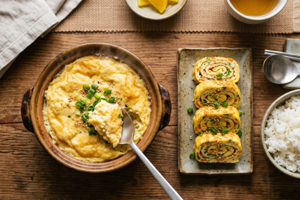 Korean steamed egg gyeranjjim and sliced gyeran mari egg roll with rice